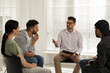 © New Africa - Psychotherapist working with group of drug addicted people at therapy session indoors