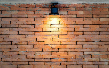 Brickwall backdrop with the tungsten lights from spotlight for Art Exhibition or vintage classic display product background.