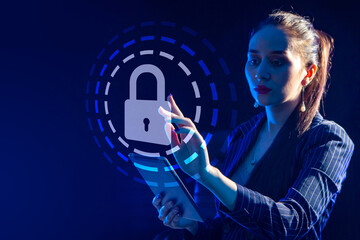 Poster - businesswoman clicks on security symbol on virtual screen. lock as a symbol of security systems. wom