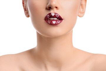 Poster - Beautiful young woman with hearts on lips against white background, closeup