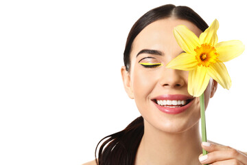 Beautiful young woman with stylish makeup and flower on white background