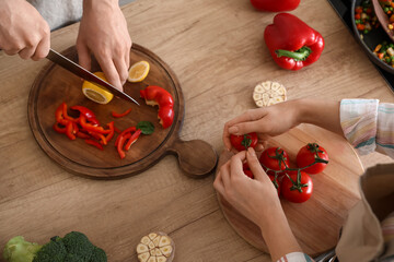 Young couple cooking in kitchen