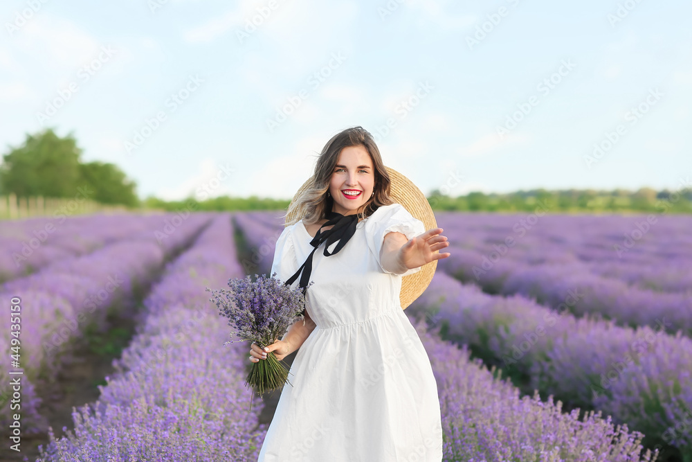 Beautiful young woman in lavender field