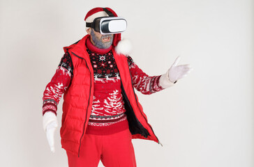 Santa Claus put on virtual glasses and plays.