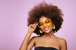 © Oleg Gekman - Beauty portrait of African American girl in colored sunglasses. Beautiful black woman. Cosmetics, makeup and fashion