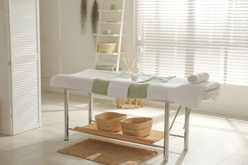 Canvas Print - Stylish spa salon interior with massage table