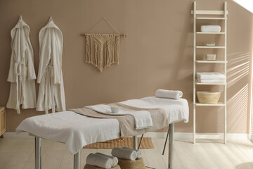 Sticker - Stylish spa salon interior with massage table