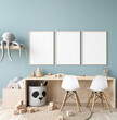 Picture frame mock up in nursery interior, wooden desk  on blue wall background, 3d render
