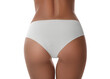 © New Africa - Woman in panties on white background, closeup. Back view