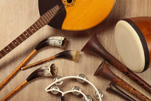 Set Of Different Vintage Musical Instruments On Wooden Background, Flat Lay