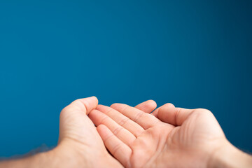 Poster - male  shows outstretched hand with open palm