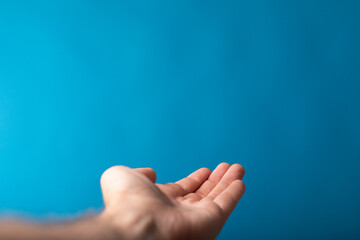 Wall Mural - male  shows outstretched hand with open palm