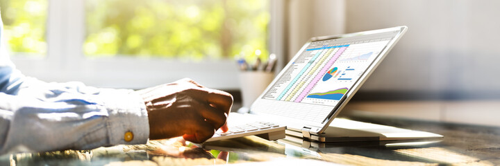 Poster - Spreadsheet Data On Hybrid Laptop Screen