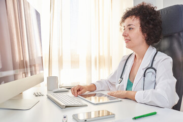 A female doctor works with patients remotely