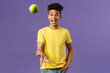Holidays, vitamins and vacation concept. Portrait of handsome upbeat young male student asking friend something eat, catching apple and smiling happy, standing purple background
