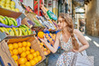 © RomeroCorpas Foto - Young woman at the groceries street market