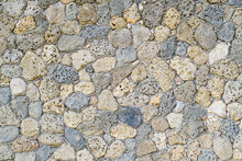 The Texture Of The Decorative Wall Made Of Natural Sea Stone. Selective Focus In The Center Of The Frame