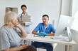 © SHOTPRIME STUDIO - a patient at a doctor's appointment and a nurse in a hospital office