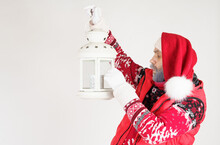 Santa Claus Holds A Lantern In His Hands.