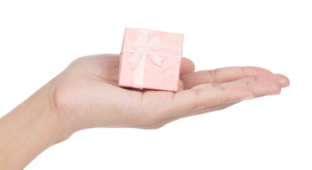 Sticker - Hand holding Pink gift box with ribbon and bow isolated on white background