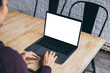 © panitan - computer screen blank mockup.hand woman work using laptop with white background for advertising,contact business search information on desk at coffee shop.marketing and creative design