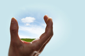 Wall Mural - sky and clouds in human hand