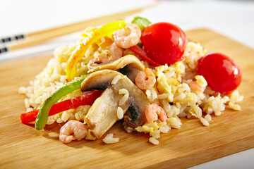 Canvas Print - Chicken Fried Rice with Vegetables. Asian style food on white background. Wooden dish with chopsticks.