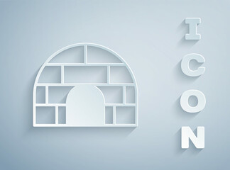 Wall Mural - Paper cut Igloo ice house icon isolated on grey background. Snow home, Eskimo dome-shaped hut winter shelter, made of blocks. Paper art style. Vector