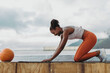 © Jacob Lund - Fitness woman practicing yoga on rooftop