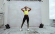 © Jacob Lund - African fitness woman relaxing on rooftop