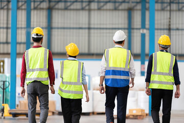 back view factory workers walking in warehouse for start a work