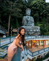 Asian girl travelling and visiting a Buddhist temple