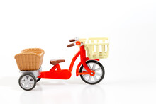 Red Tricycle With Basket On White Background