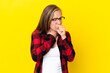 © luismolinero - Young English woman isolated on yellow background coughing a lot