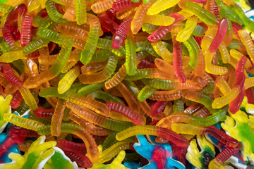 Sticker - Colorful jelly candies in the form of worms. Candy background