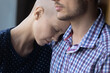 © fizkes - Tired depressed young hairless ill woman exhausted with cancer treatment, chemotherapy, leaning hugging husband, leaning head on male shoulder, getting love, support, empathy. Close up
