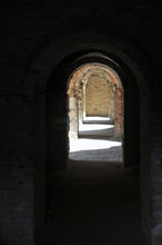 A Through Corridor Through The Casemates Of The Defensive Barracks In The Rays Of Sunlight.