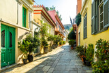 Fototapeta Uliczki - Buildings in the district of Plaka in Athens by the Acropolis