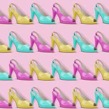 Trendy Fashion Pattern Made Of Many Elegant Sandals With High Heels On A Pink Background.