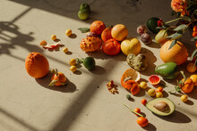 Still Life Of Tropical Fruits Included Citruses, Avocados And Dragonfruit In Window Light