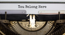 You Belong Here Symbol. Words 'You Belong Here' Typed On Retro Typewriter. Diversity, Inclusion, Belonging And You Belong Here Concept. Copy Space.