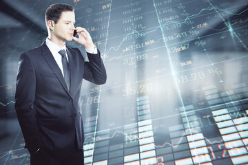 Aufkleber - Attractive young european businessman talking on the phone on blurry office interior background with forex chart. Trade and communication concept. Double exposure.