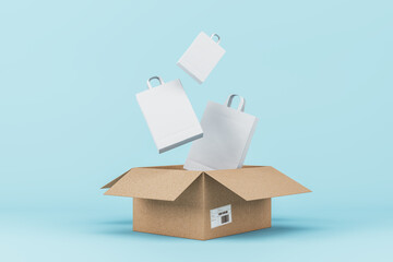 Wall Mural - Carton box with shopping bags on blue background. Delivery service concept. 3D Rendering.