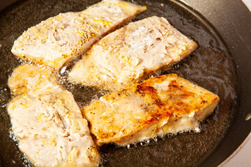 Wall Mural - Fish marinade preparation steps: Frying sea bass pieces