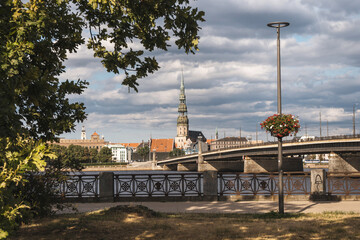 Wall Mural - View of the Stone Bridge and St. Peter's Church in Riga. Riga is the capital city of Latvia,famous European baltic country