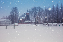 Poland, Subcarpathia, Trzcinica, Church At Town Square During Winter Snowfall