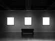 Three mockup white blank museum art frames on dark grey wall background with lighting and empty museum seating bench.
