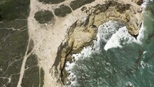 Birds Eye View Following The Limestone Cliffs With Tilt-up Reveal Of The Faro Morrillos Lighthouse In Cabo Rojo Puerto Rico.