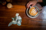 Hot steaming almond milk coffee being make in Australia.