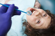 © mad_production - Top view close up of a happy boy getting his teeth examined by dentist